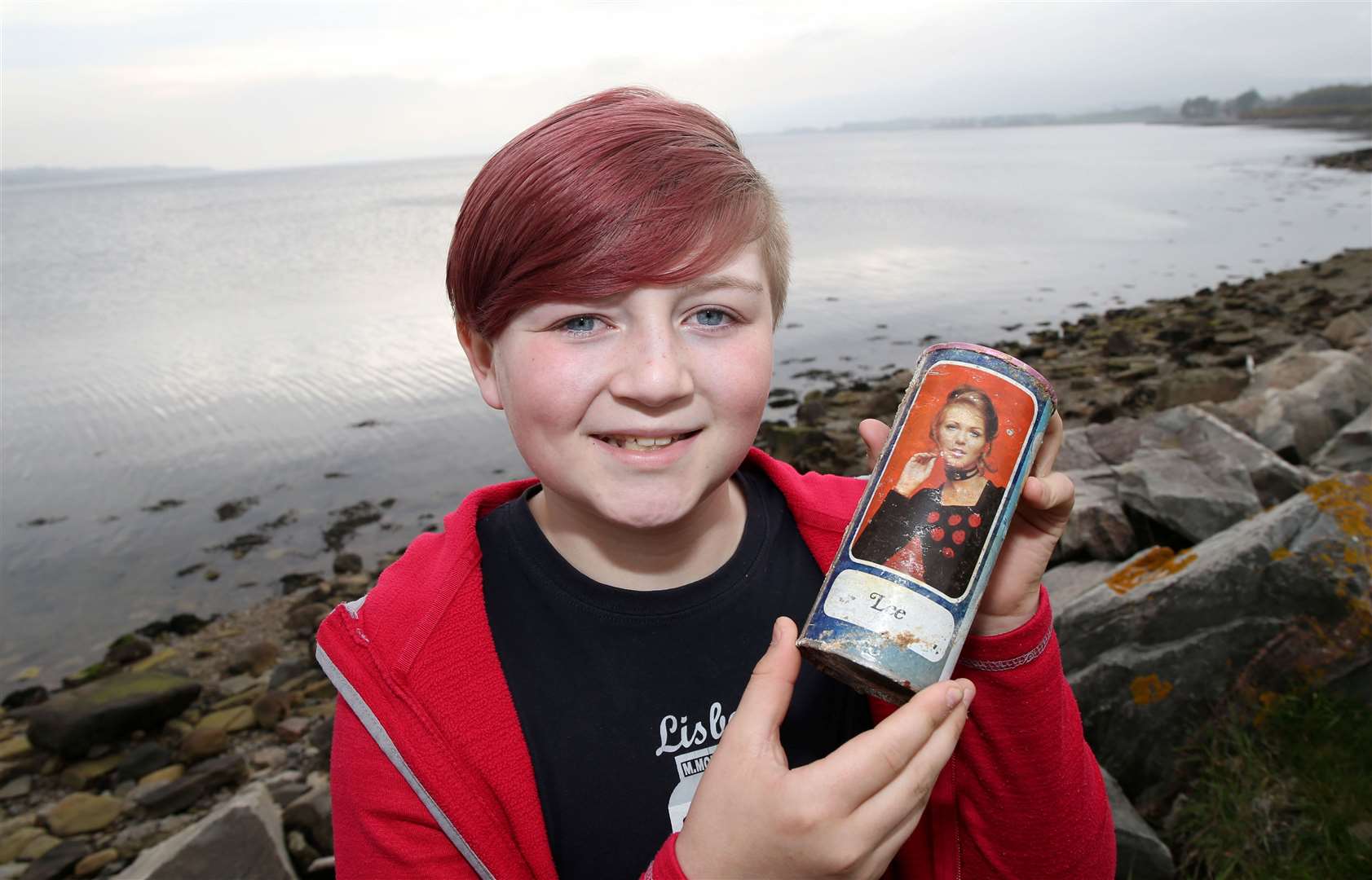 Jack Emery (11) with the Tennent's lager can from 1975 that he found whilst walking along the shore of the Cromarty Firth with his mum Fiona. Picture: Peter Jolly