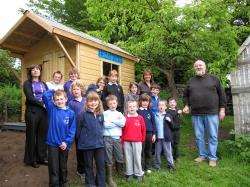 Landlord of the Pittentrail Inn, Hector Miller, hands over the keys of Rogart Primary School's new playhouse to primary one pupil Ben Coburn. Also in the picture are the school's two teachers, Helene Kaspis (far left) and Anne Mackay.