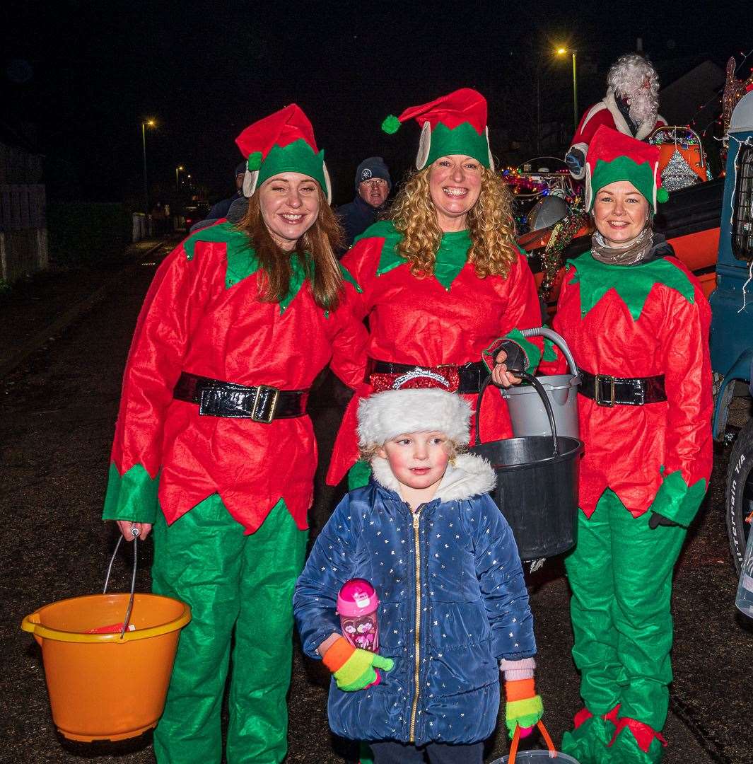 Santa's elves, from left Carol Mackay, Vicky MacKenzie and Tracey Pauley, were ably assisted by young Alexandra Graham, the daughter of an ESRA crew member. Picture: Andy Kirby