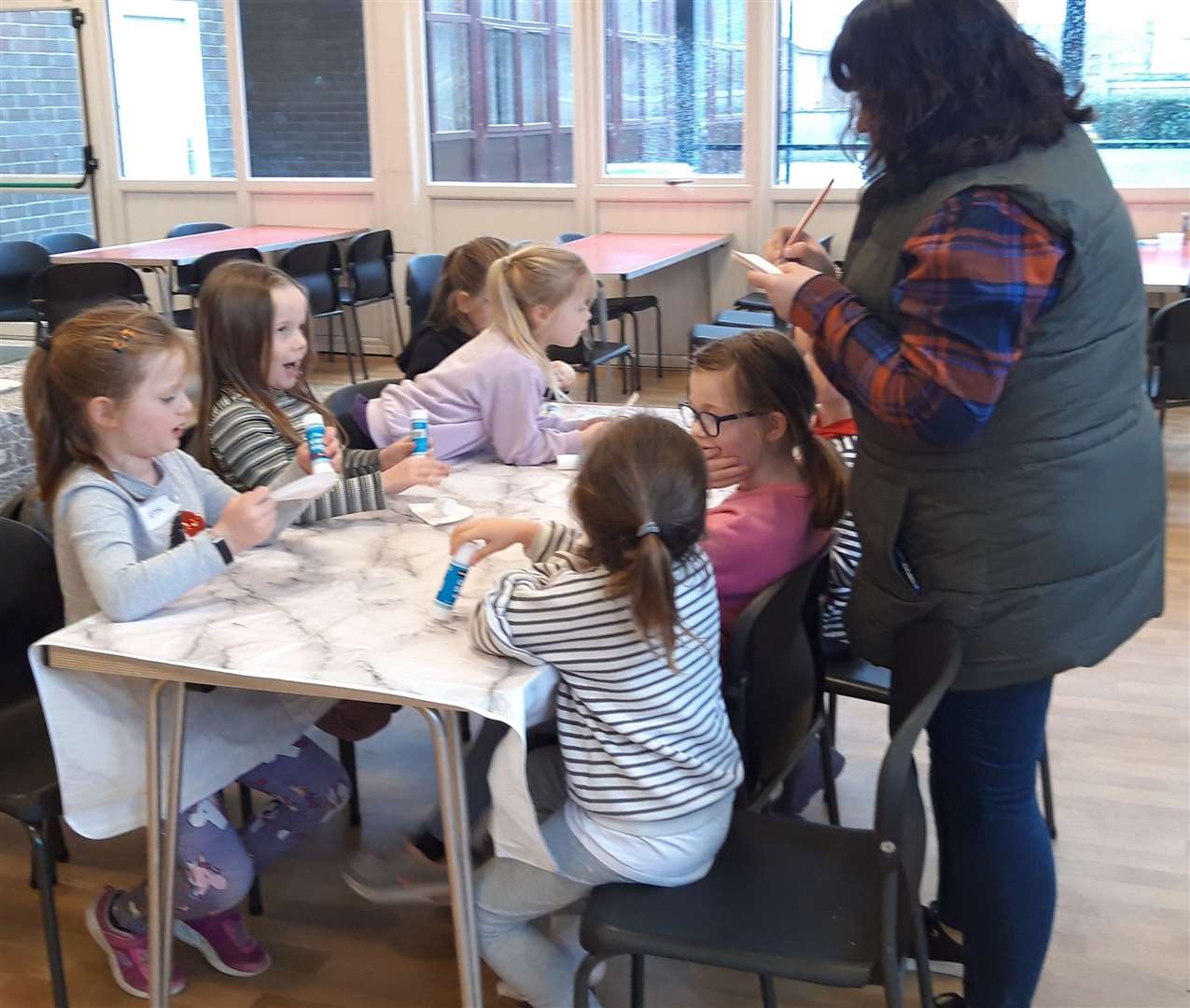Outgoing Fèis Chataibh secretary Debbi Celli helps children in the five to seven year old age group at a Feis Day last year.