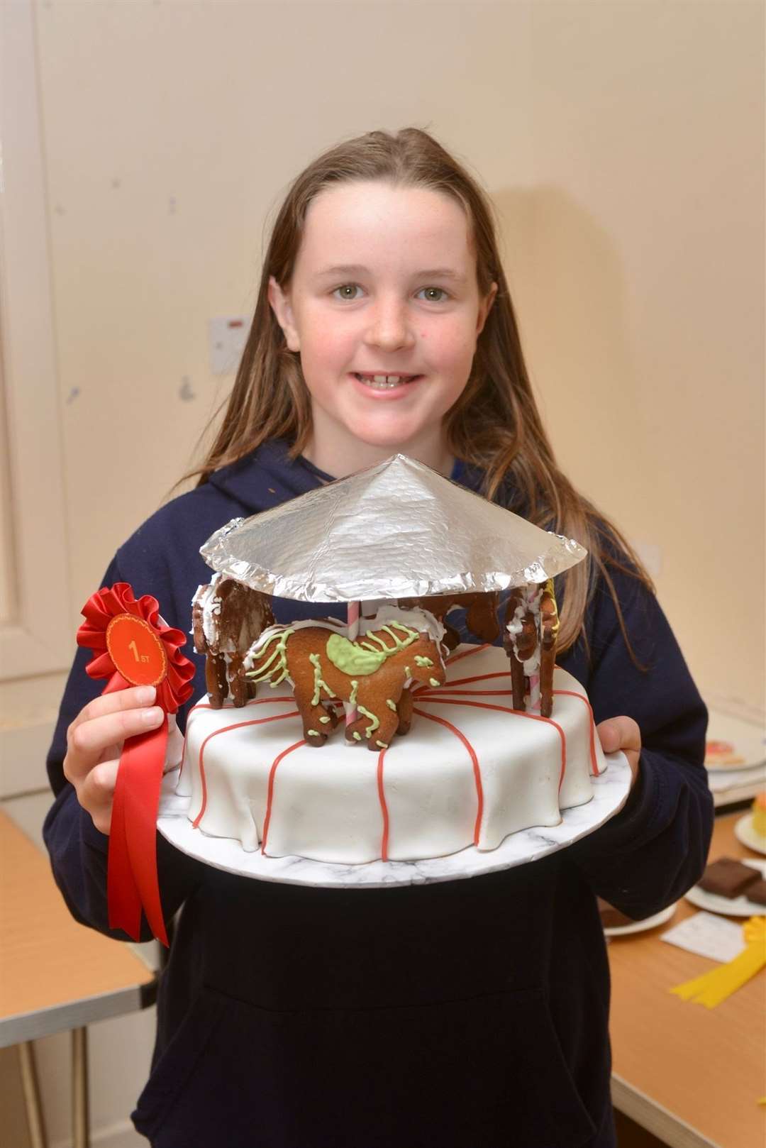 Maisie Mackenzie with her prize-winning cake. Picture: Jim A Johnston