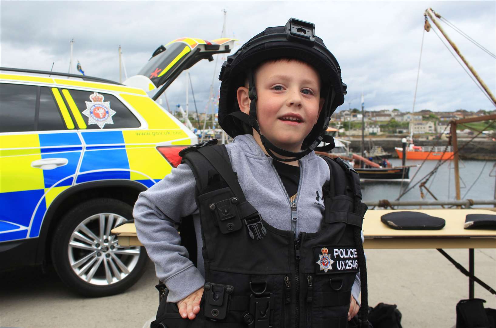 Noah Miller (7), from Wick, trying out some Civil Nuclear Constabulary kit. Picture: Alan Hendry