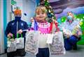 Community hero teams up with Tain tot to bring Christmas cheer 