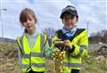 Brora pupils cut sod with golden spade at symbolic groundbreaking ceremony for Old Clyne School project