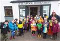 Kids jumping for joy at Ullapool Bookshop on World Book Day