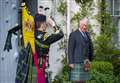 His Royal Highness takes salute from piper at Balmoral to mark St Valéry anniversary