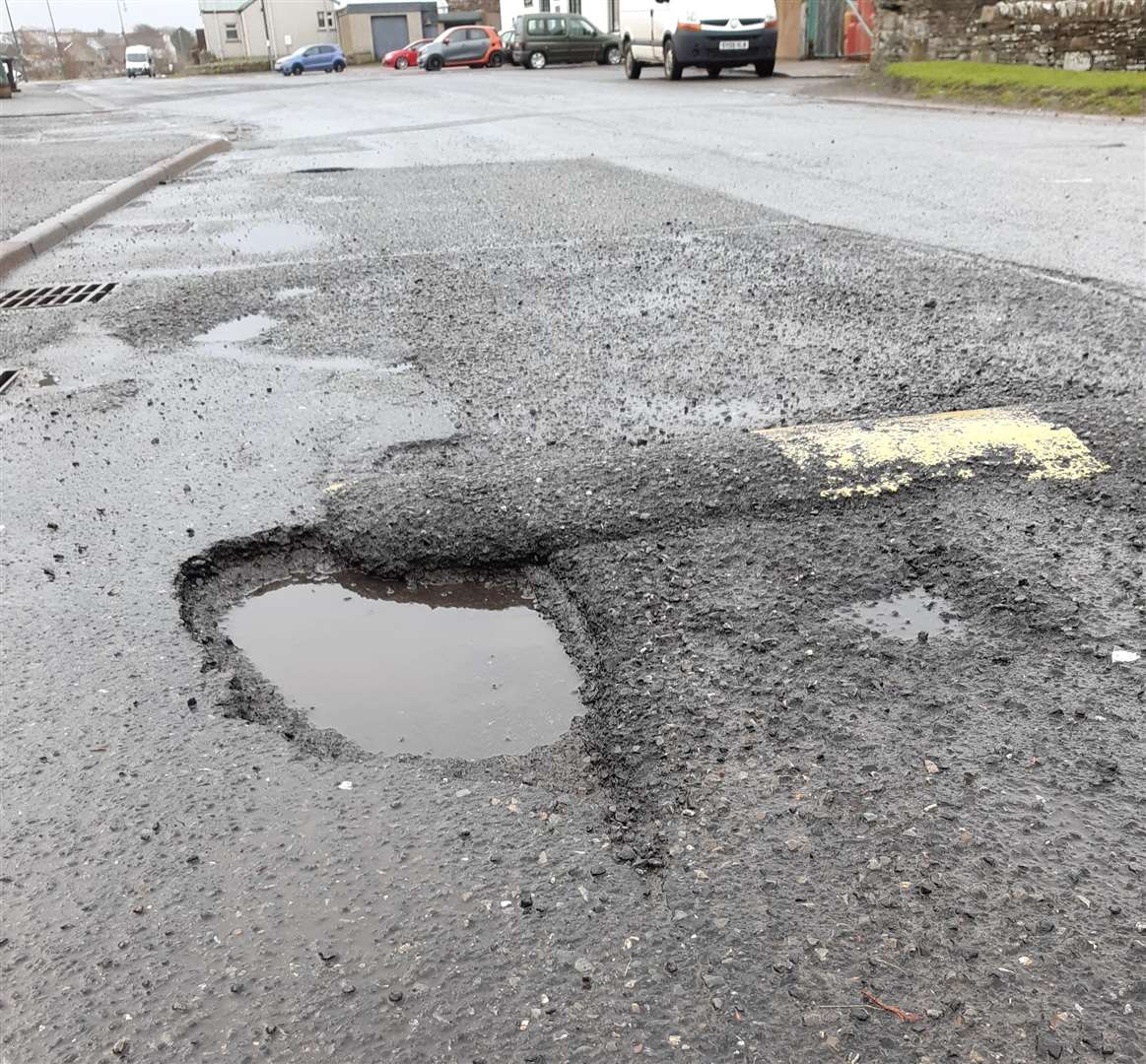 A large pothole beside a speed bump in Thurso's Riverside Road – 'traffic-calming retaken to an extreme'. Picture: Matthew Reiss
