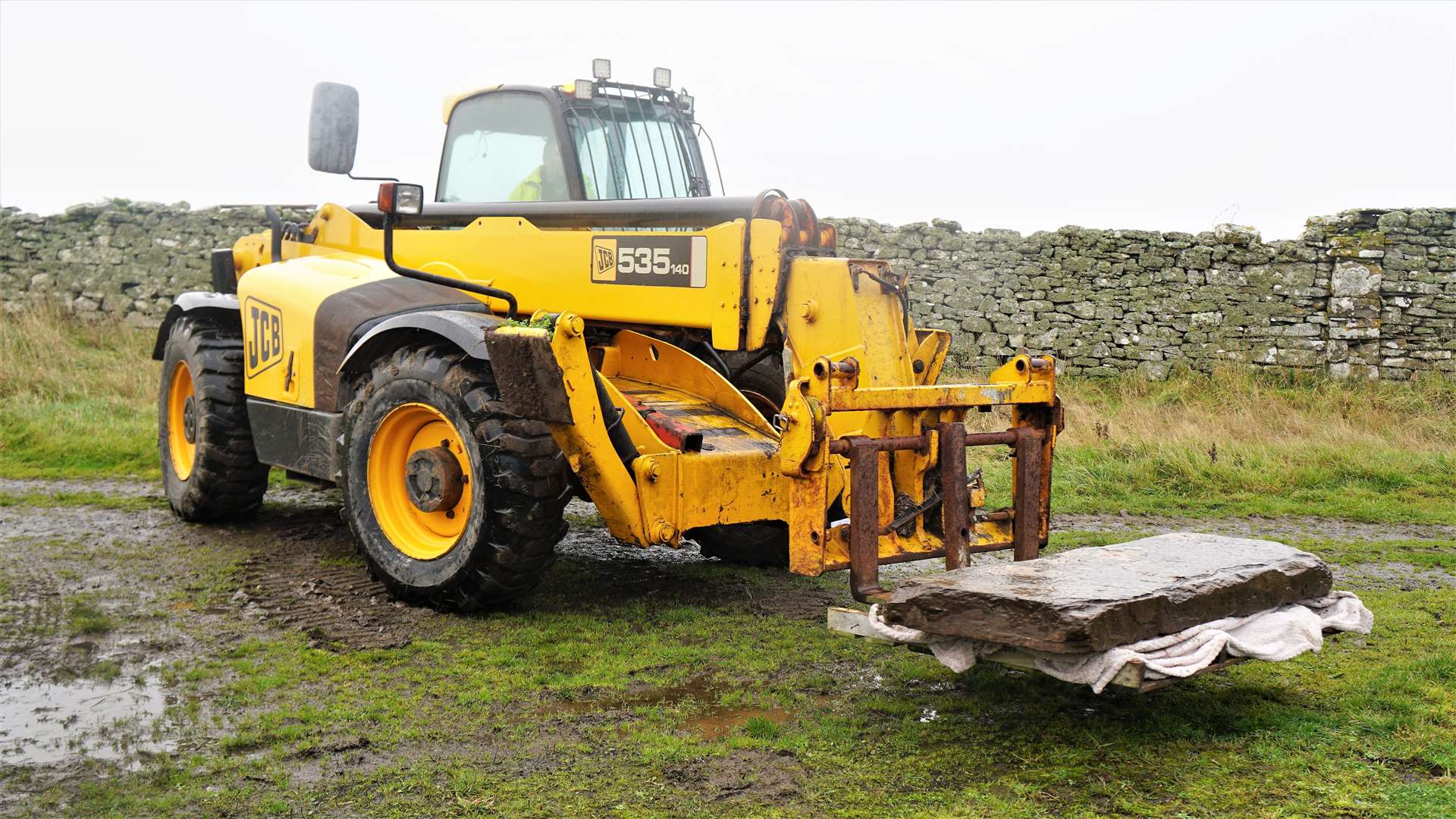 David Dunnett of DD Joinery was asked to help remove the slab and used his JCB to lift it from the graveyard. Picture: DGS