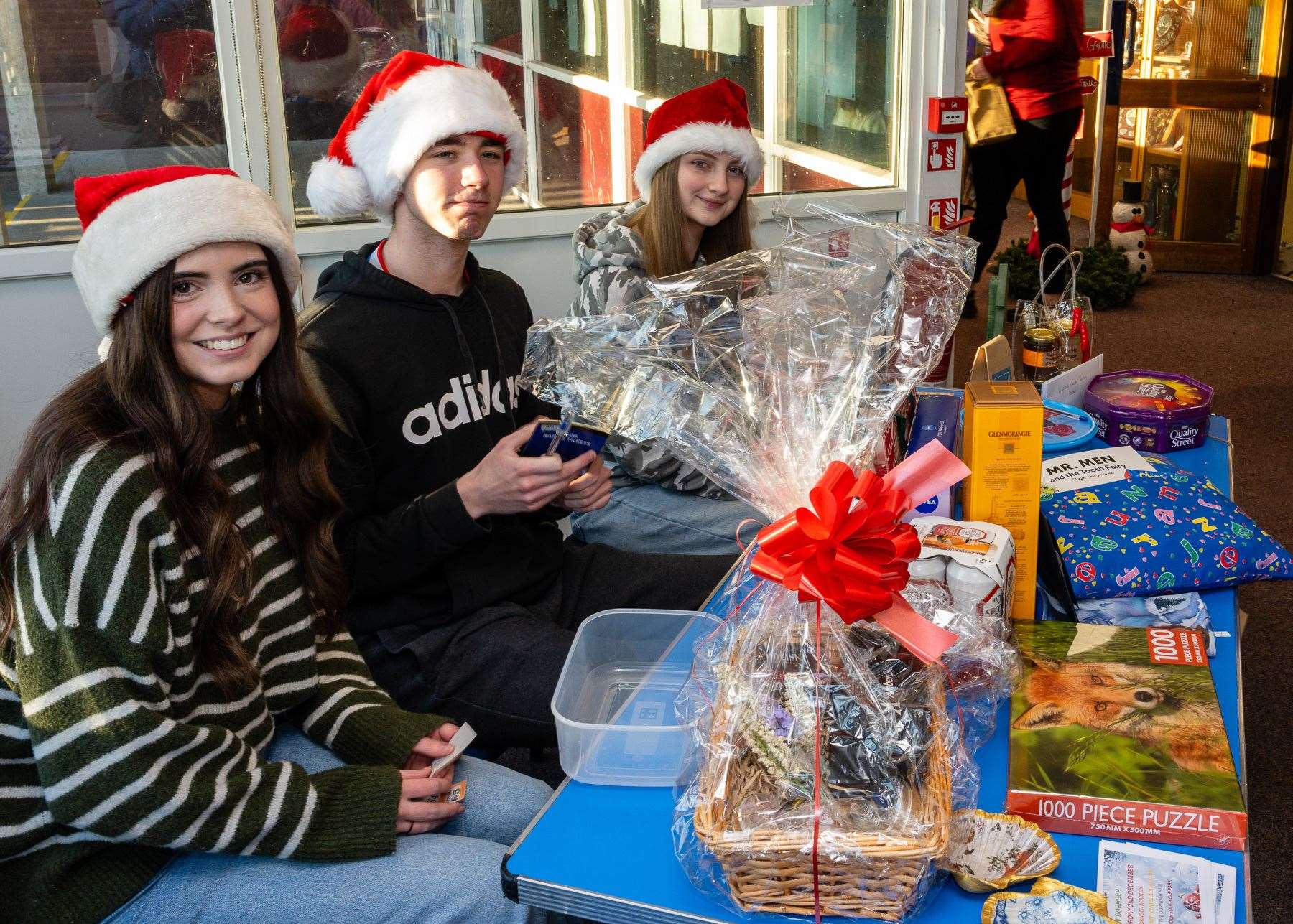 Aimy Fraser, Matthew Gallon and Katie Hogart manned the Dornoch Academy raffle stall. Picture: Andy Kirby