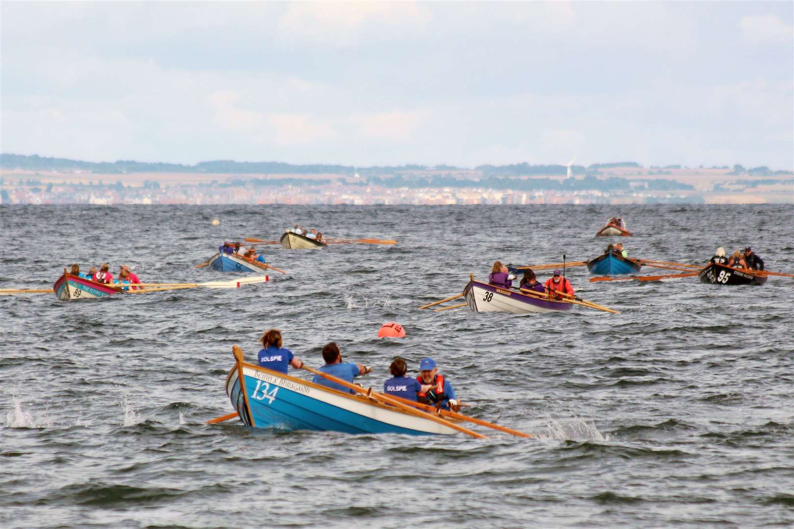 Traditionally, the course is from the harbour out round Criagleith and back, a distance of 3.4Km, but windy overnight conditions meant that the initial races all took place on a long triangular course inside the island. Picture: David Richardson