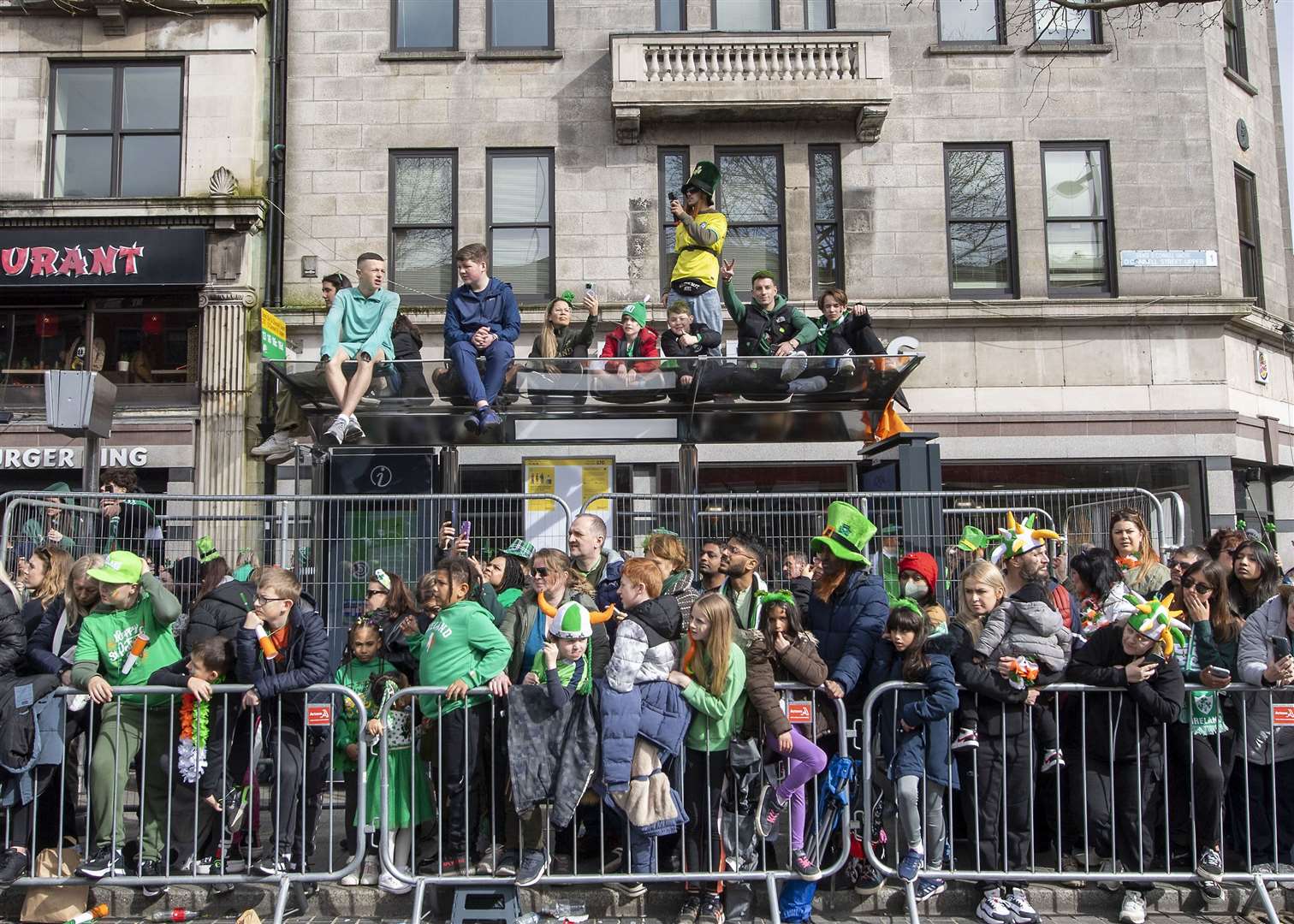 Crowds utilised various vantage points to get a good view of the celebrations (Michael Chester/PA)