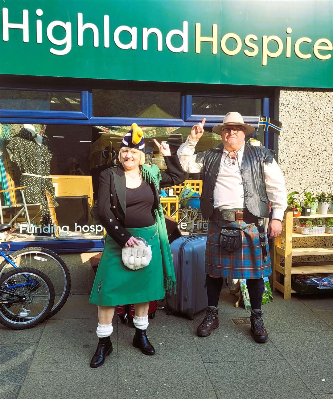 Manager of Highland Hospice charity shop Susan Imlach with David Bertrum who, together with his wife Anne, made baking for the tourists. Picture supplied