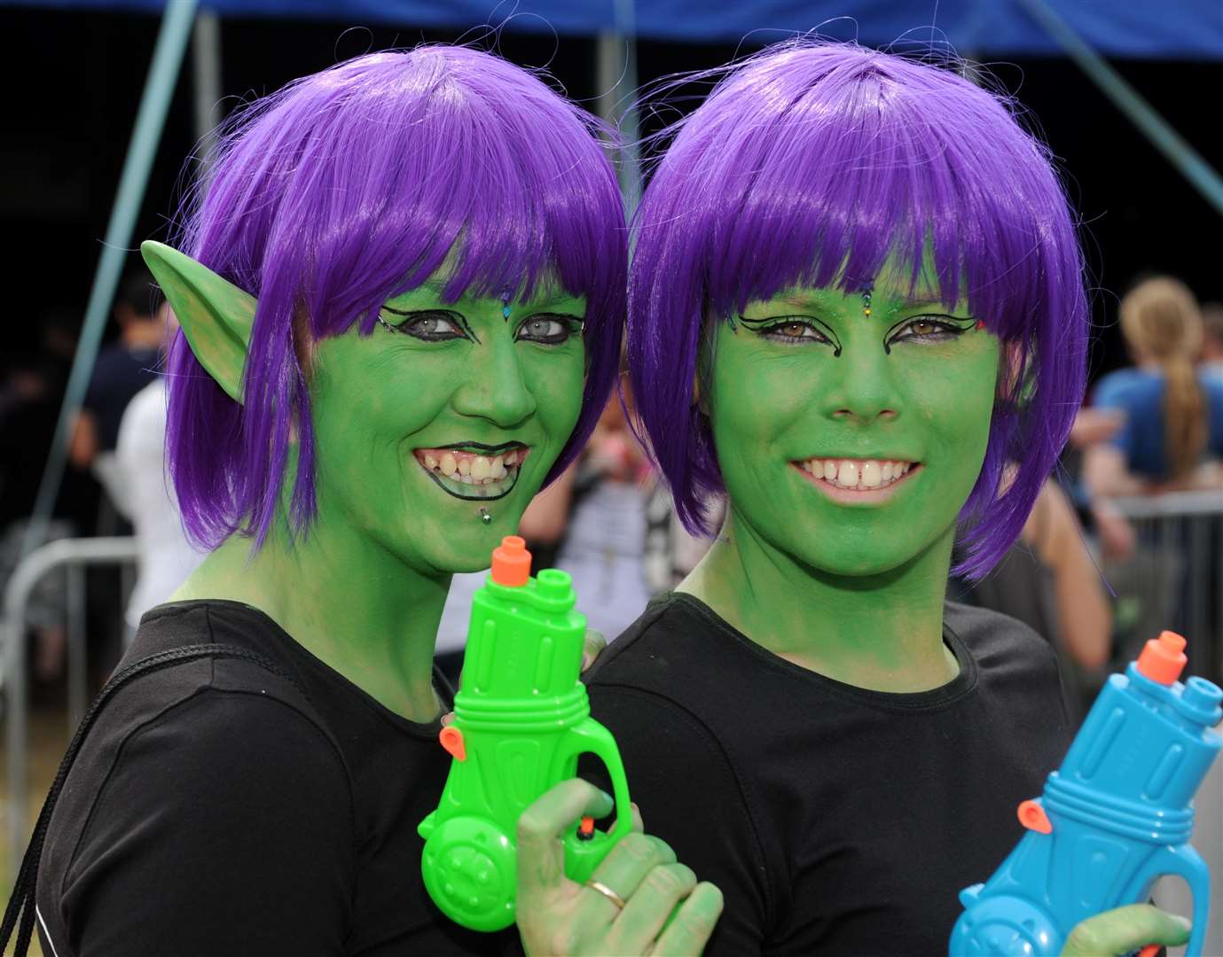 The fancy dress themes inspires creative festival-goers, here space, for Charlotte Benfield and Annabelle Silvey, rocking their green space elf look.