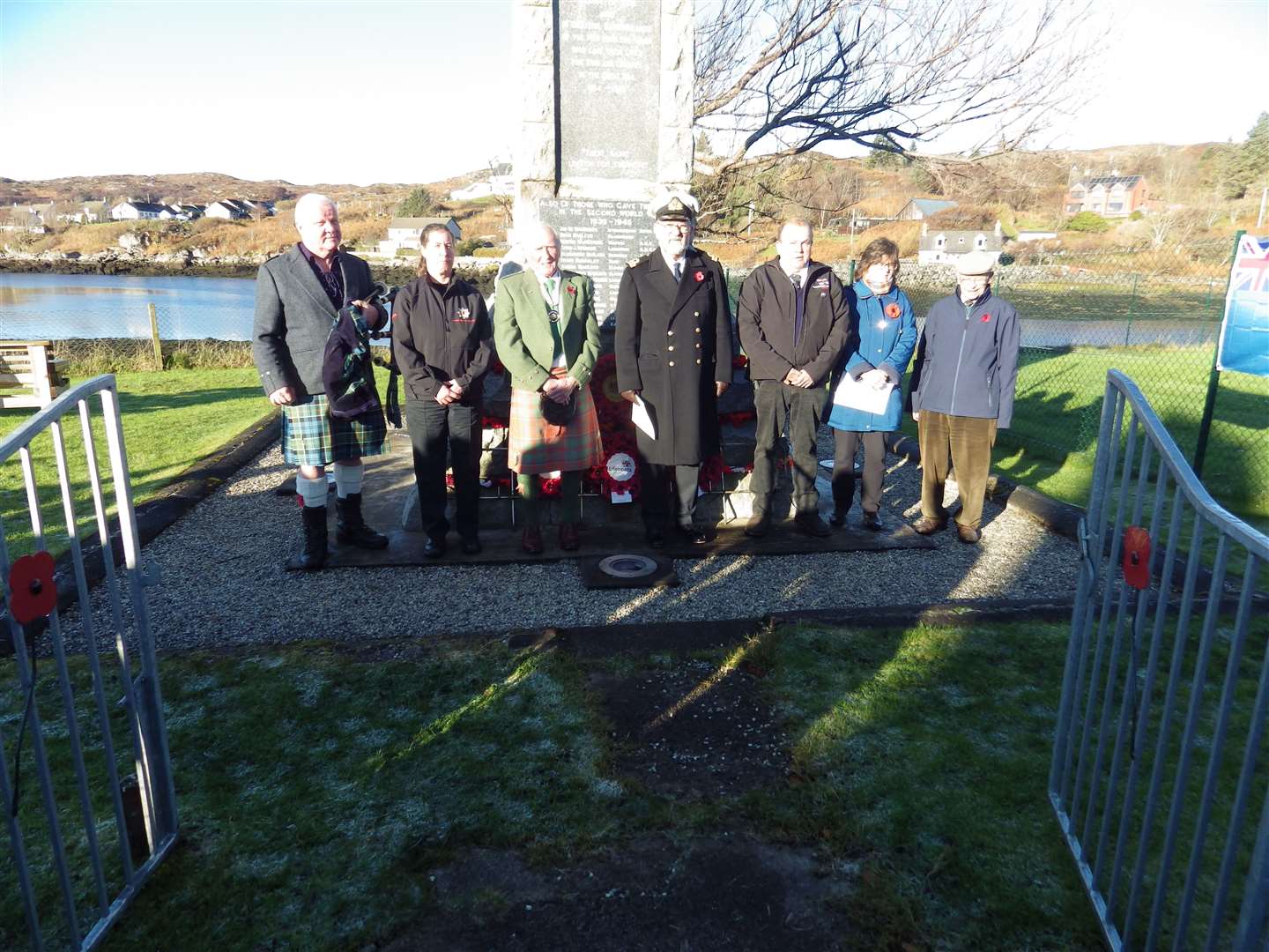 Stuart McClelland (centre) took the service. Piper was Charlie Cowan (left), while wreaths were laid by, from left, Jorine Van Delft, David Grant, David MacAskill and Fiona Hamilton. Ian Mackenzie read the Ode of Remembrance.