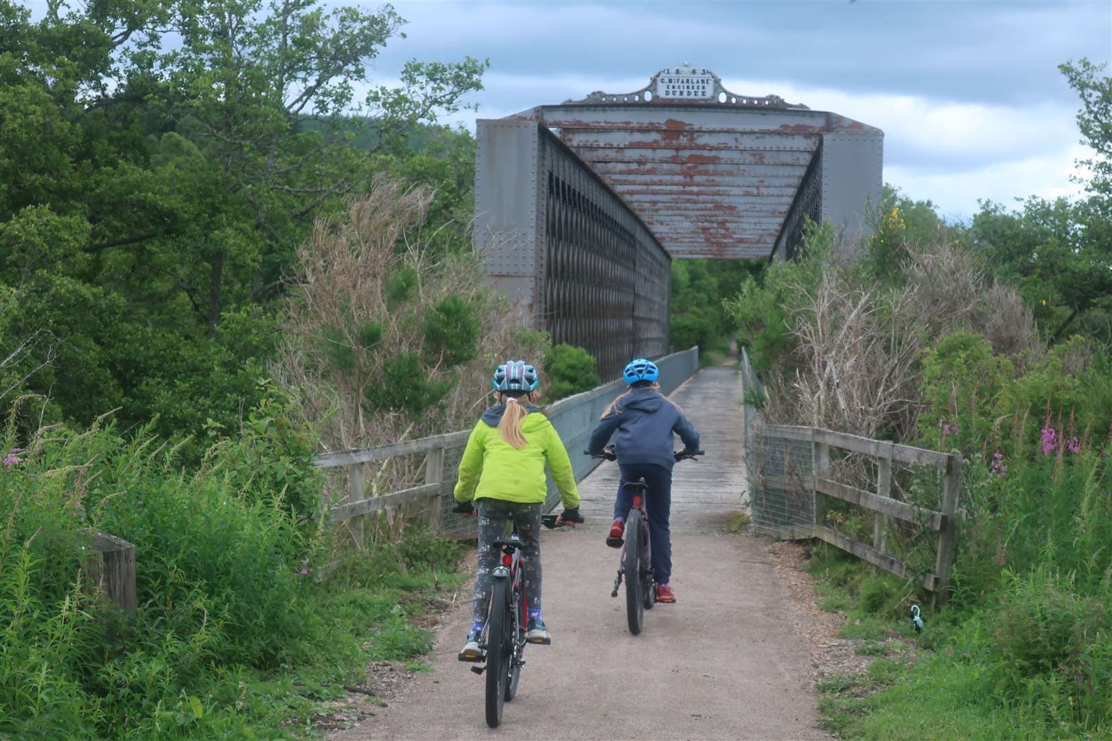 Cycling towards the Ballindalloch bridge on the Speyside Way.