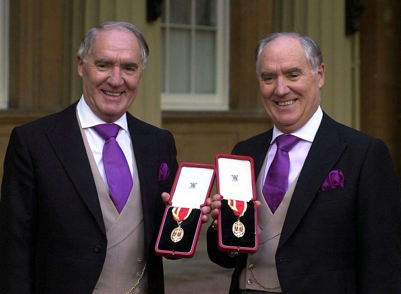 Sir Frederick Barclay, right, with his twin brother, Sir David Barclay, after they were knighted (Michael Stephens/PA)
