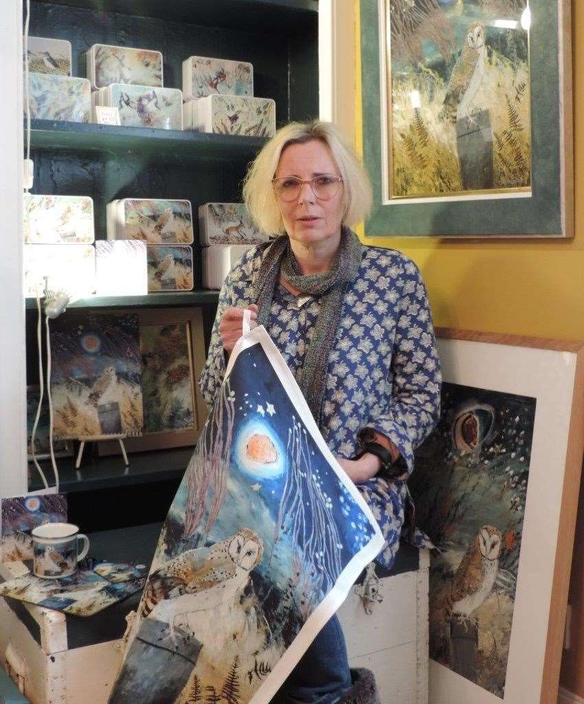 Ingebjorg Smith with owl tea towel and other creations.