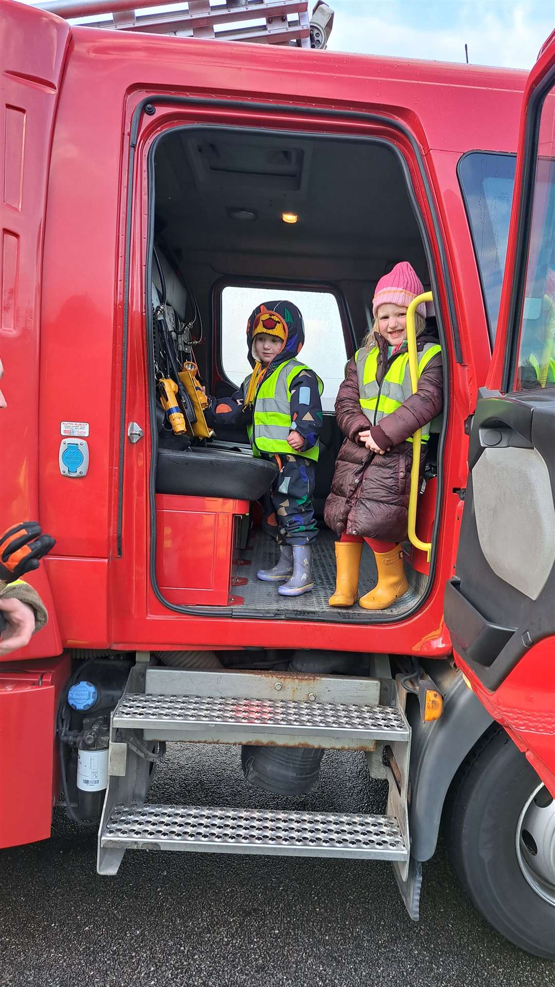 Lena Mackay, whose father is one of the Tongue crew, and Nell Gunn Maclean enjoyed climbing into the cab of the fire truck.