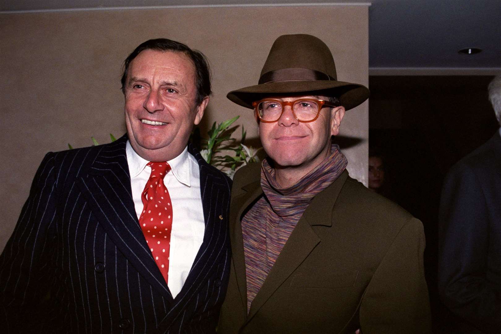 With Sir Elton John in 1991 (PA)