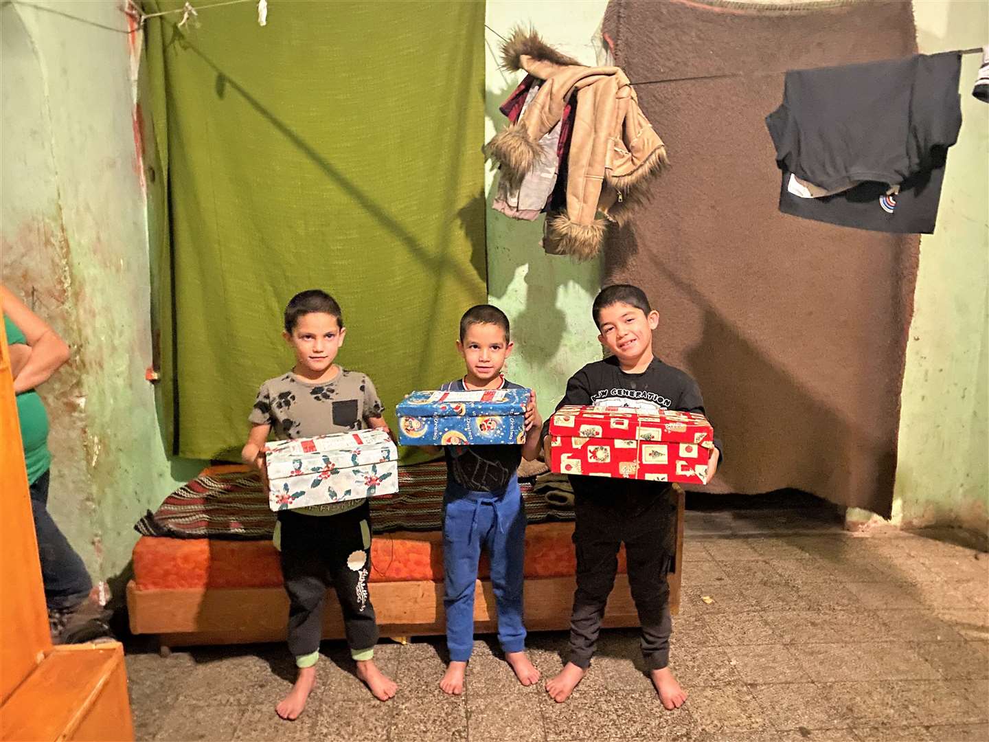 Brothers Rikardo, Jozsef and Zoltan – boxes distributed to low-income families in Ozd, northern Hungary, were processed in Shropshire.