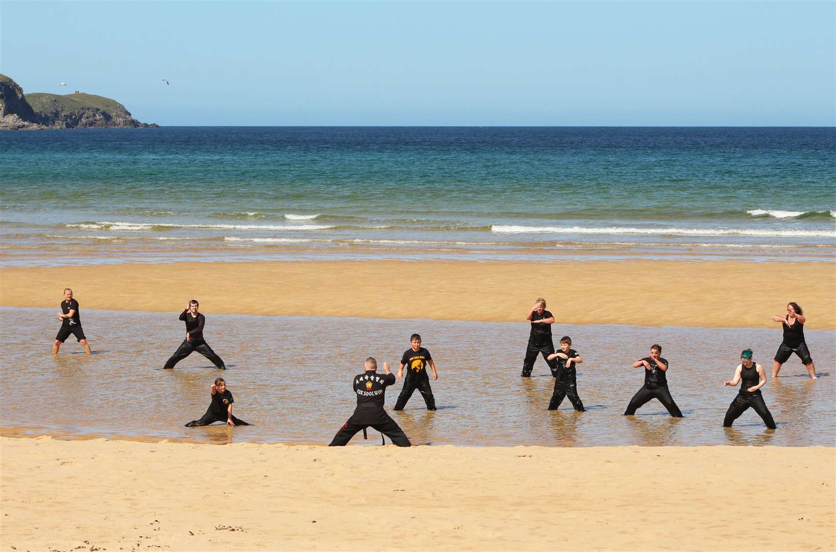 Instructor Donald Mackenzie puts devotees of martial art Kuk Sool Won through their paces at Strathy beach. Picture: Alan Hendry