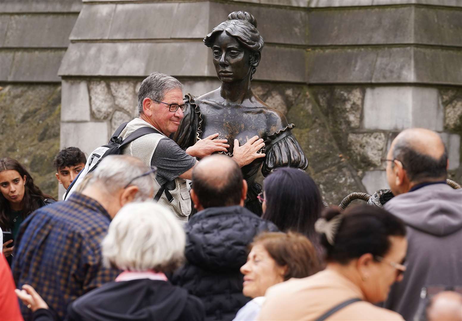 The statue of the semi-historical, semi-legendary figure of Molly Malone in Dublin city centre was vandalised with black paint in August. It did not deter people from posing for photographs at the popular tourist destination (Brian Lawless/PA)