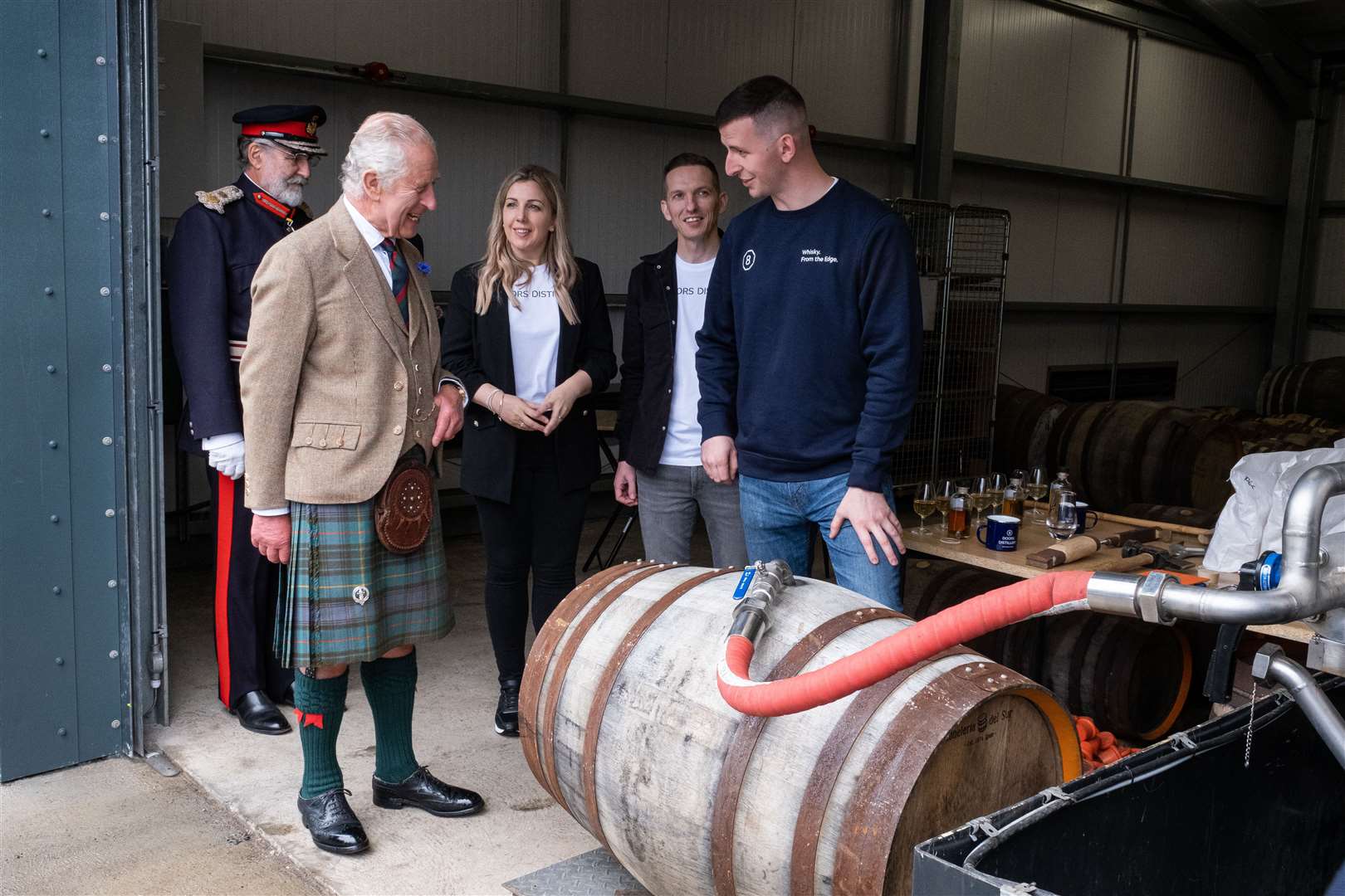 The King chats to distillery manager Ryan Sutherland before filling a cask. Picture: Susie Mackenzie