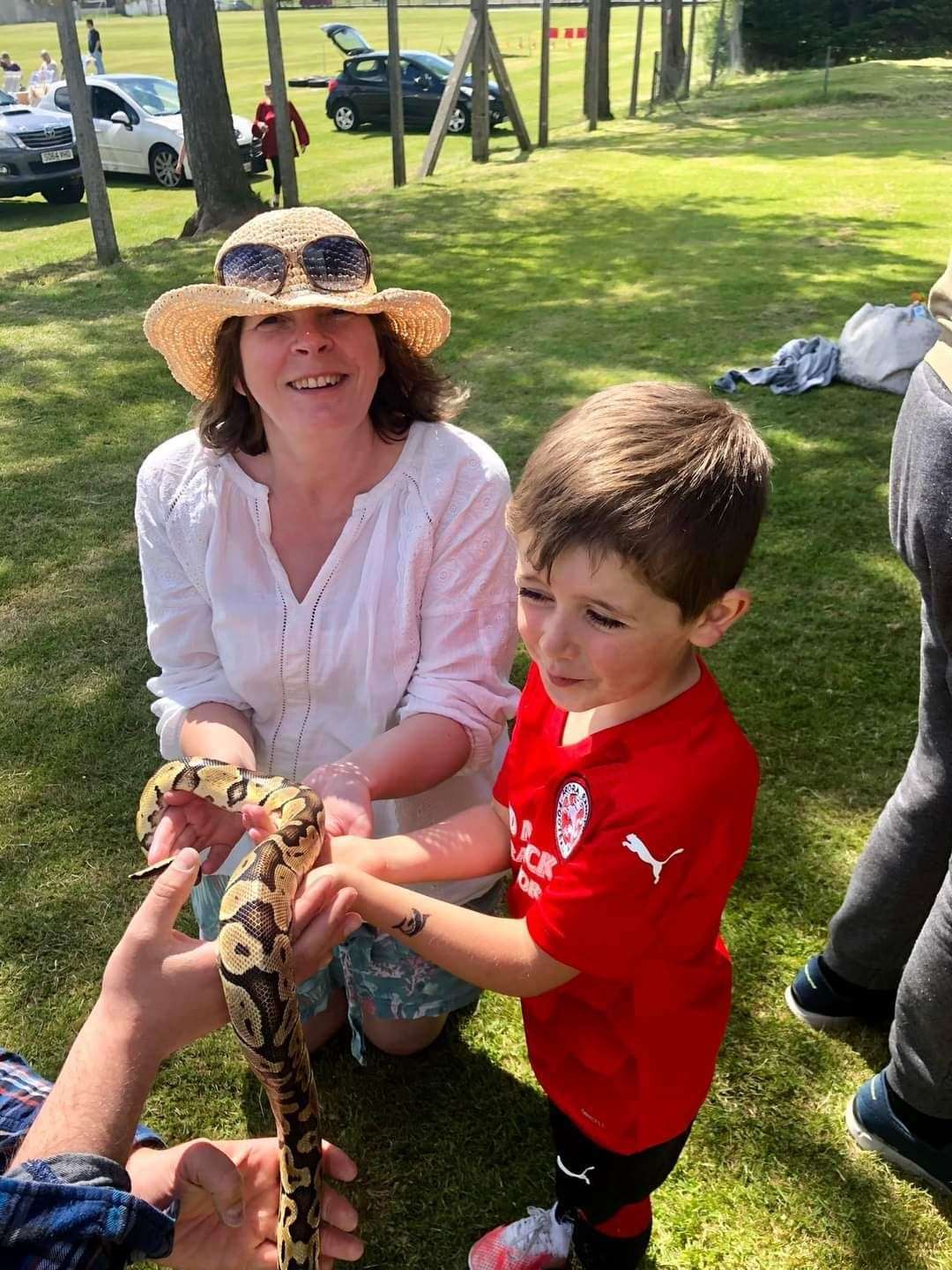 Adults and children alike seized the opportunity to touch a live snake.