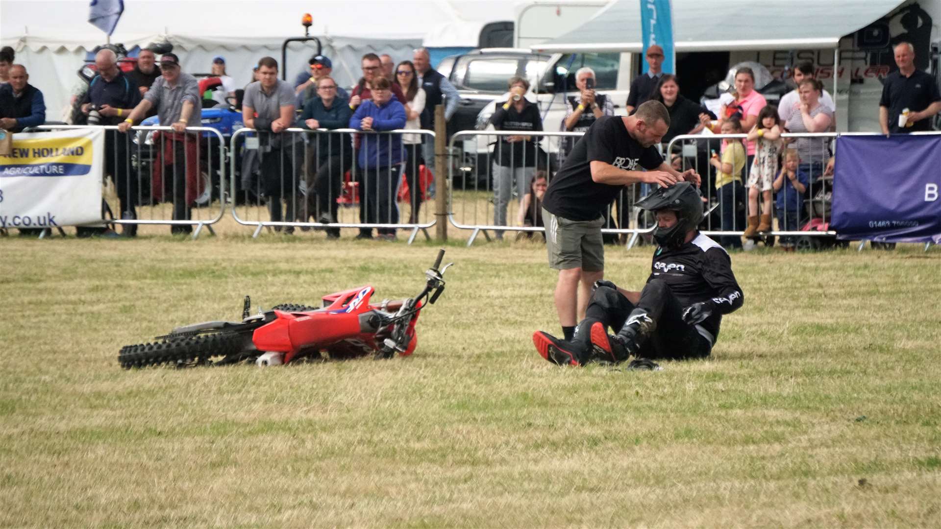 The Broke FMX safety manager, James, helps him to his feet. Picture: DGS