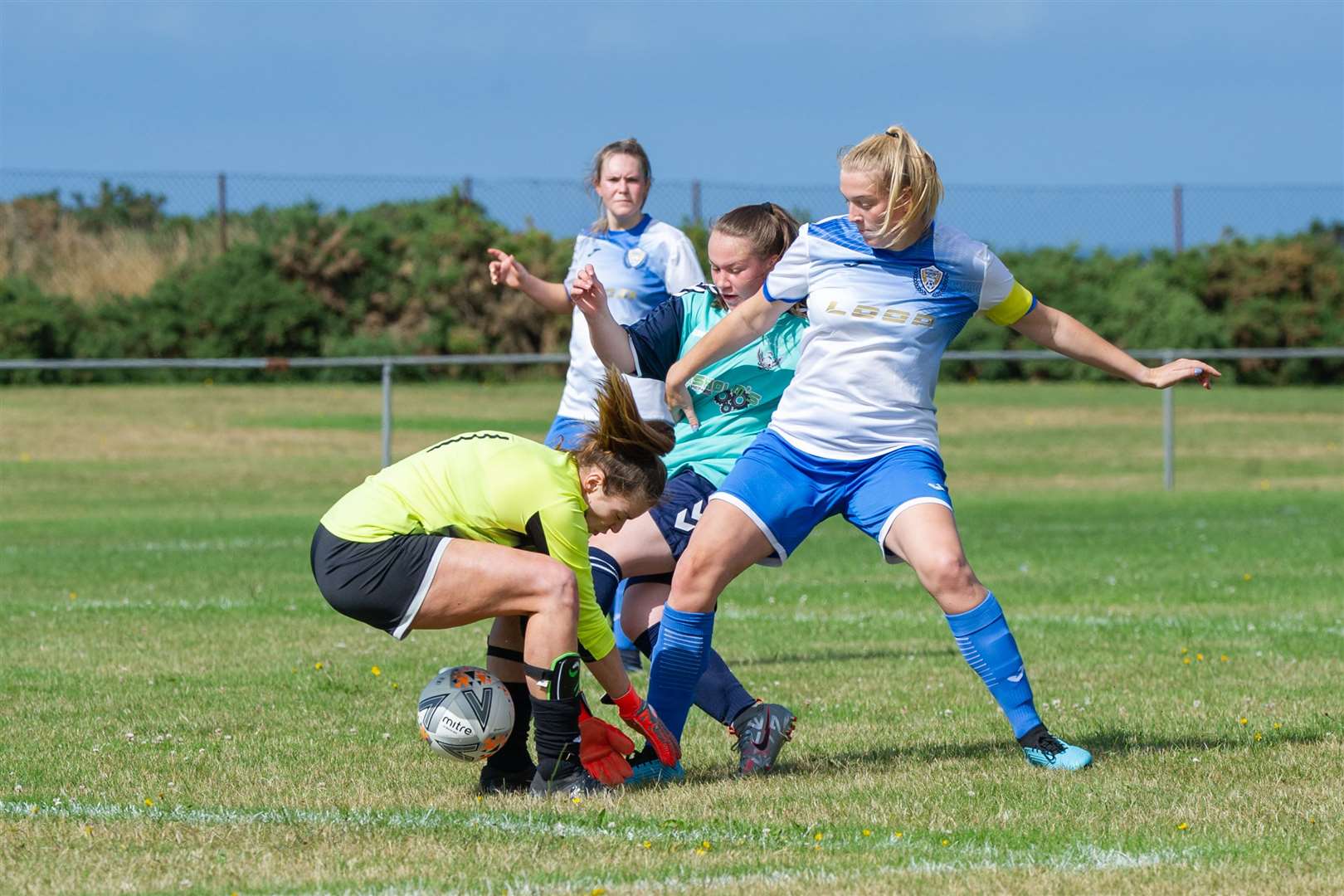 Buckie's Milly Findlay scores after a mix up between Sutherland Women's captain Bethany Sutherland and goalkeeperJennifer Moodie...Buckie Ladies FC (1) vs Sutherland Women FC (7) - Highland and Island League Cup - Merson Park, Buckie 09/08/2021...Picture: Daniel Forsyth..