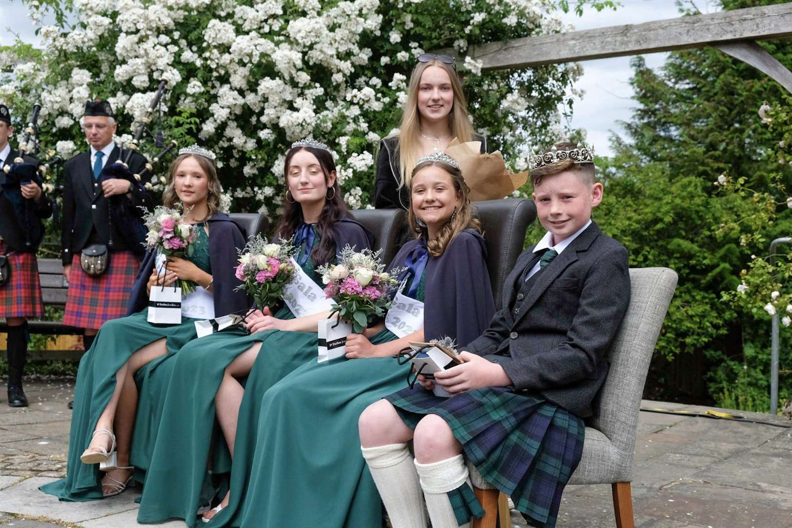Tain Gala's royal party take a moment in the spotlight at the town's Rose Gardens. Picture: Mark Janes