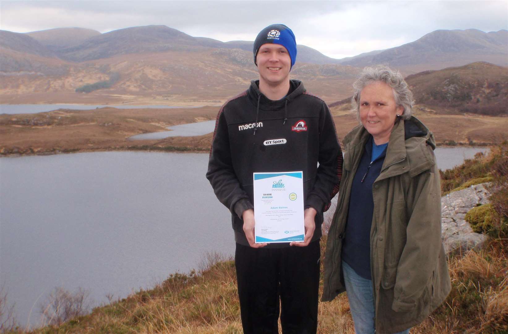 Adam Barnes, 18, was presented with his Saltire Award by Shona Marshall of the West Sutherland Fisheries Trust.