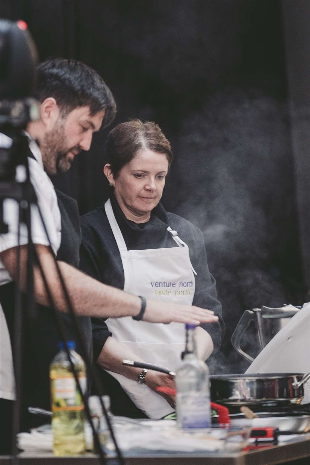 Chef Grant Macnicol is assisted by a member of the audience during one of his cookery demonstrations on Sunday. Picture: Colin Campbell Photography