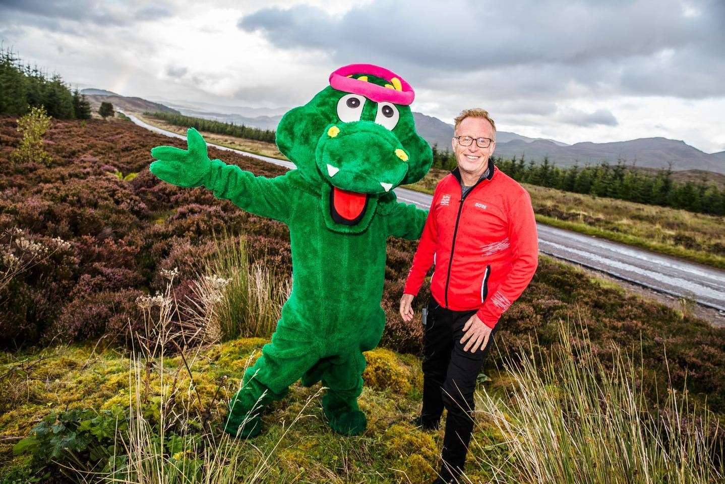 Nessie, pictured with Bryan Burnett, ran the Loch Ness Marathon's route to officially open early-bird entry to the run.
