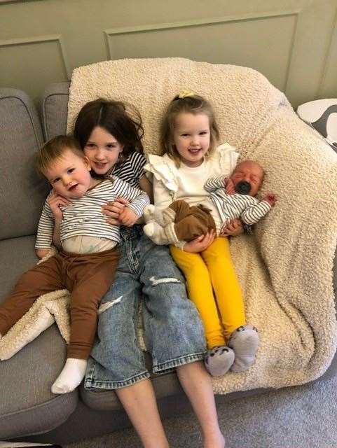 New Year baby Tommy with his siblings.