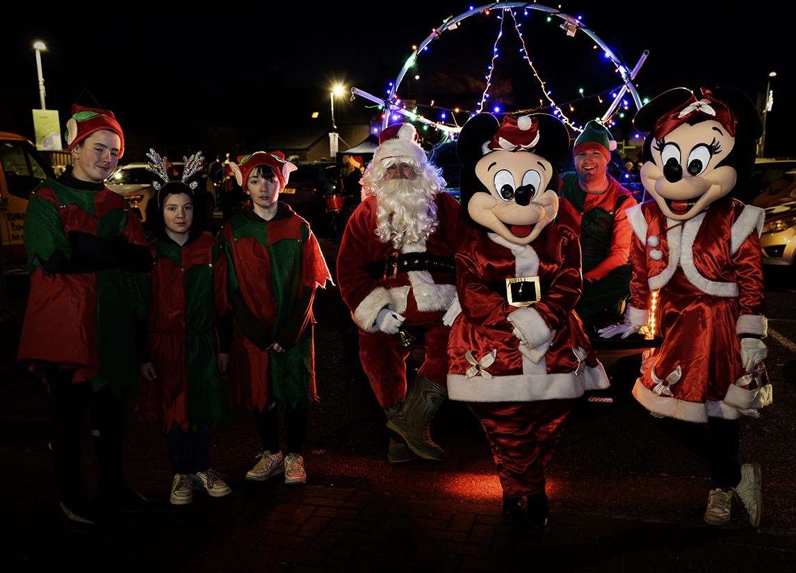 Santa and his entourage of elves stopped by. Also on hand were Mickey and Minnie Mouse, all dressed up in their Christmas best. Picture: Martin Ross