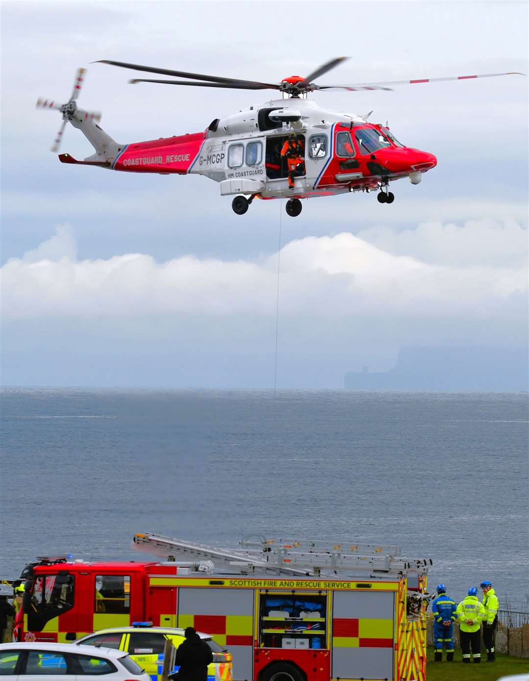 Coastguard rescue helicopter along with other emergency services at Victoria Walk in Thurso dealing with a female casualty who had fallen from the cliff. 29/03/2024. Picture supplied