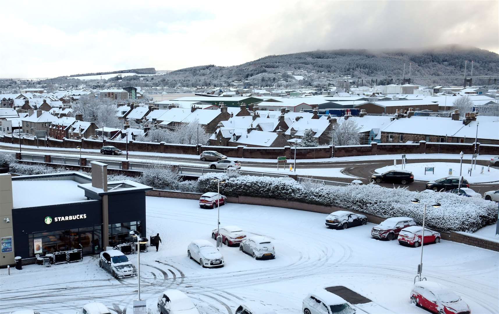 Snow seen from Inverness's Rose Street car park. Picture: James Mackenzie