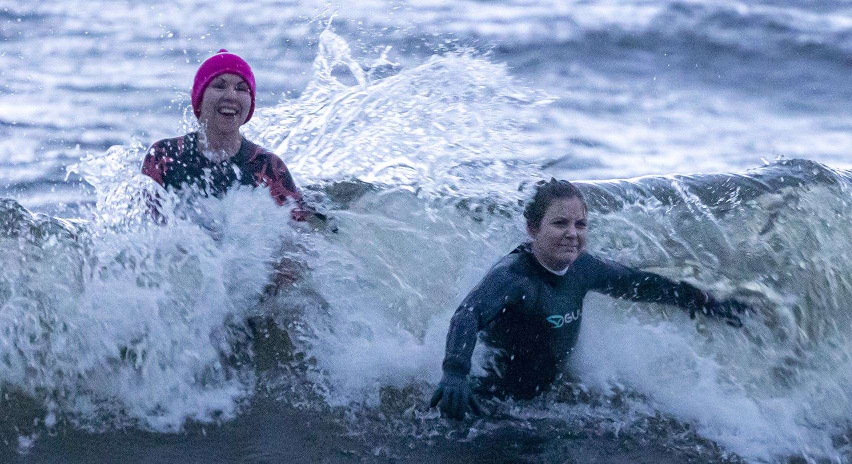 Fiona Stewart and Rhionna Mackay, Brora, brave the waves. Picture: Louise Mackay
