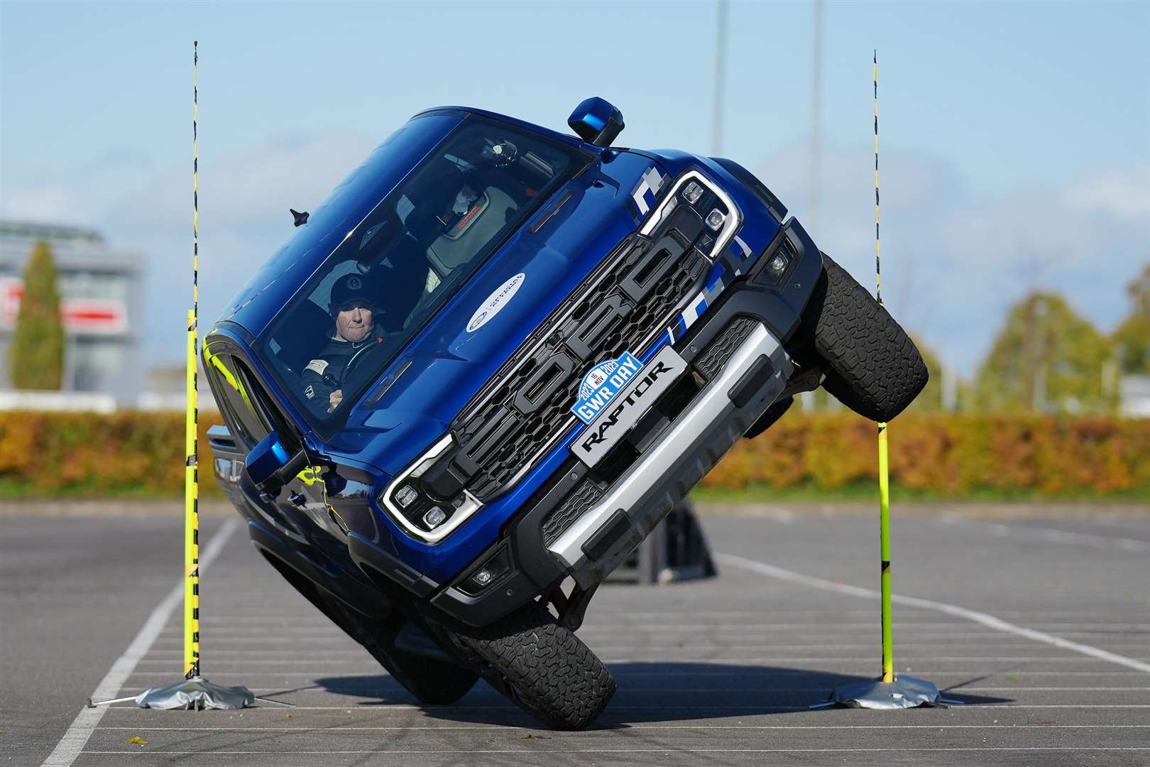 Paul Swift achieves the Guinness World Record for ‘The tightest gap driven through on two wheels in a pick-up truck (Guinness World Records Day 2023)