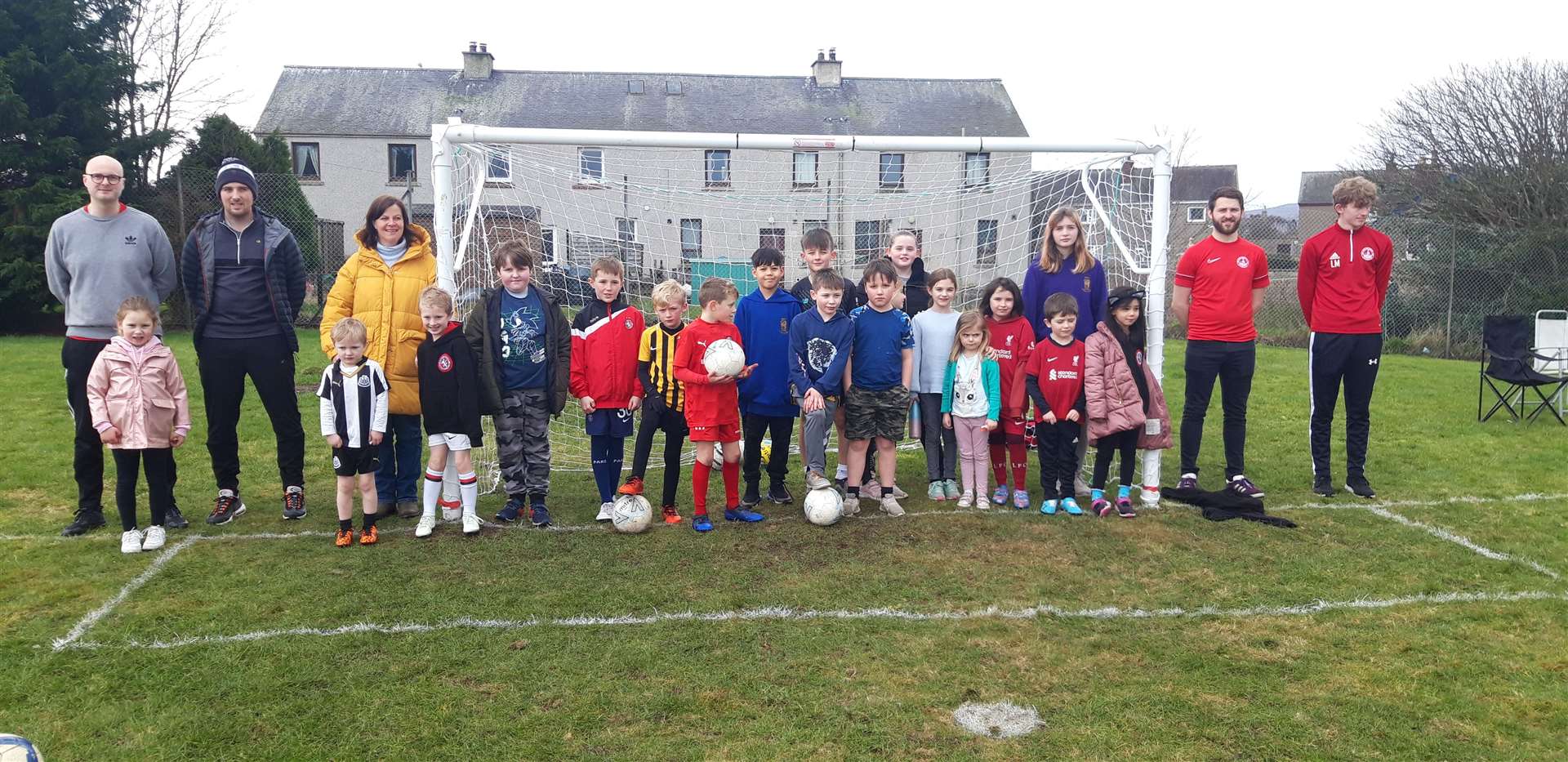 Development officer Sarah Morrison (third left) with volunteers from local clubs and some of the local youngsters who attended the Open Goals event held at Muirfield Football Pitch.