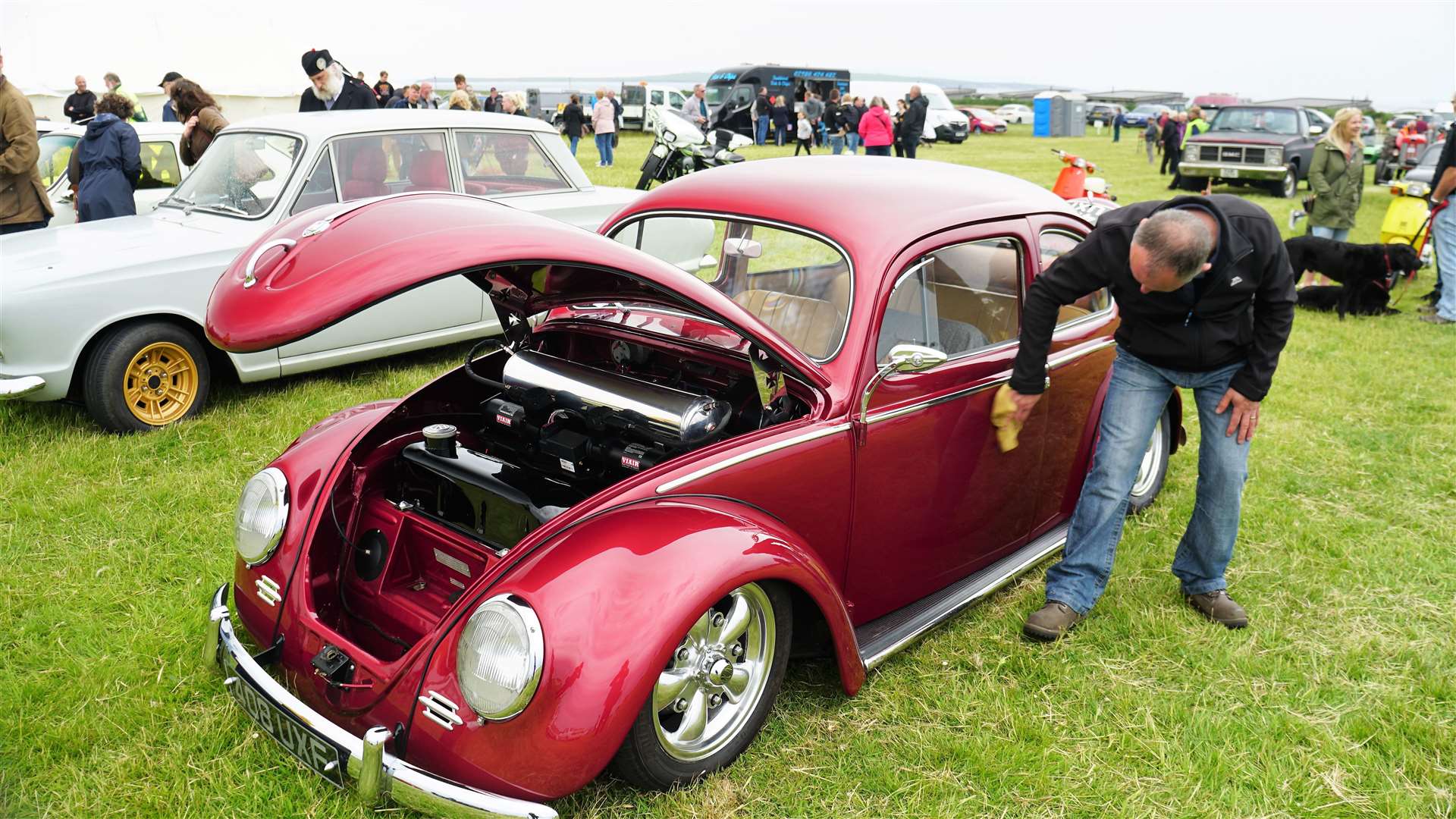 Justin Kirby polishes his custom Volkswagen that has a digitally controlled suspension system. Picture: DGS
