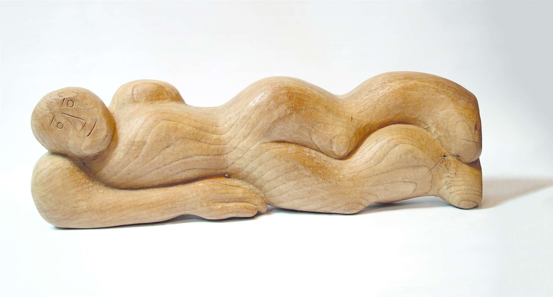 A reclining figure by Dorothy Dick.