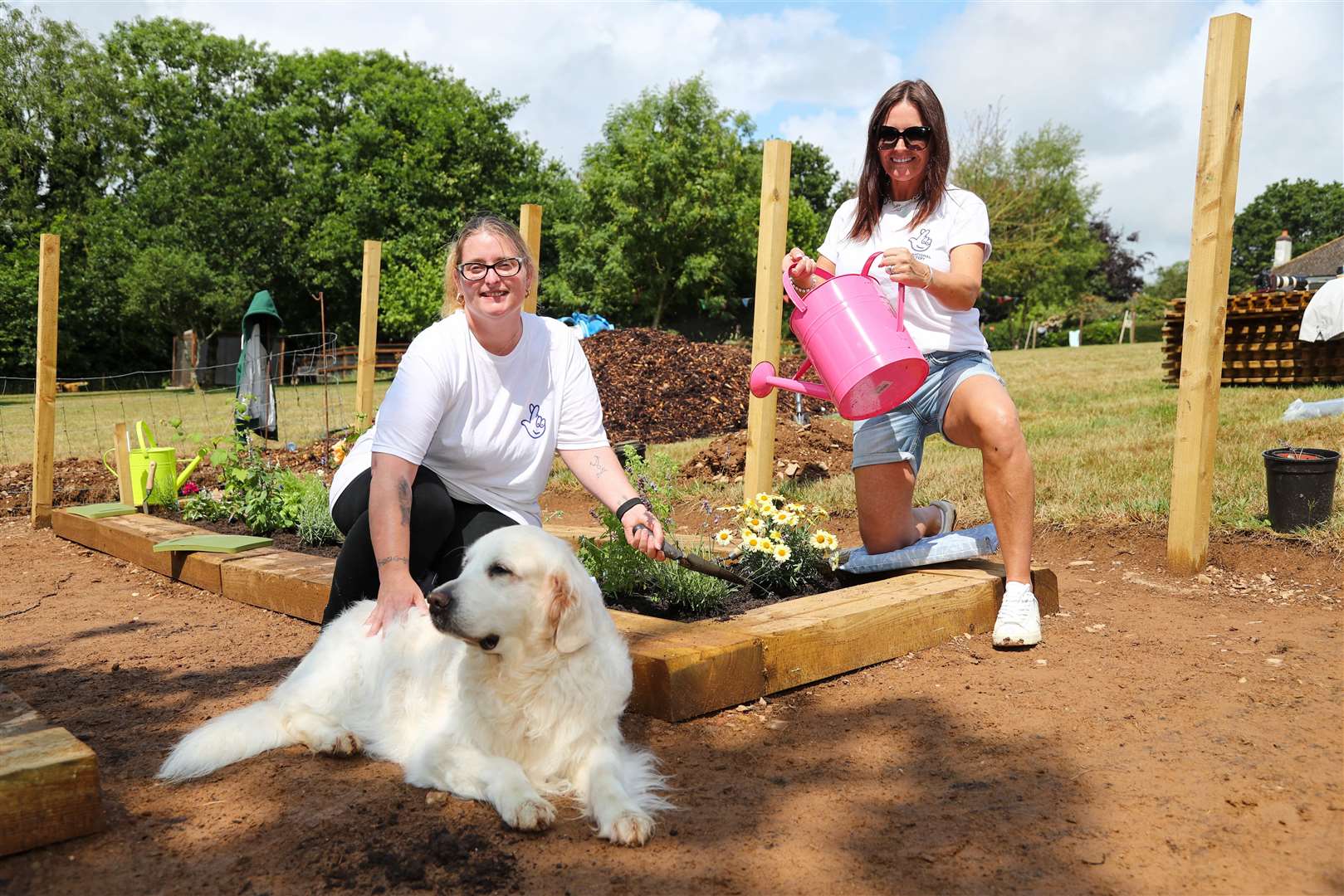 National Lottery winners, left to right, Lesley Herbert and Debbie Goolding with Zoe the dog (Martin Bennett/National Lottery/PA)