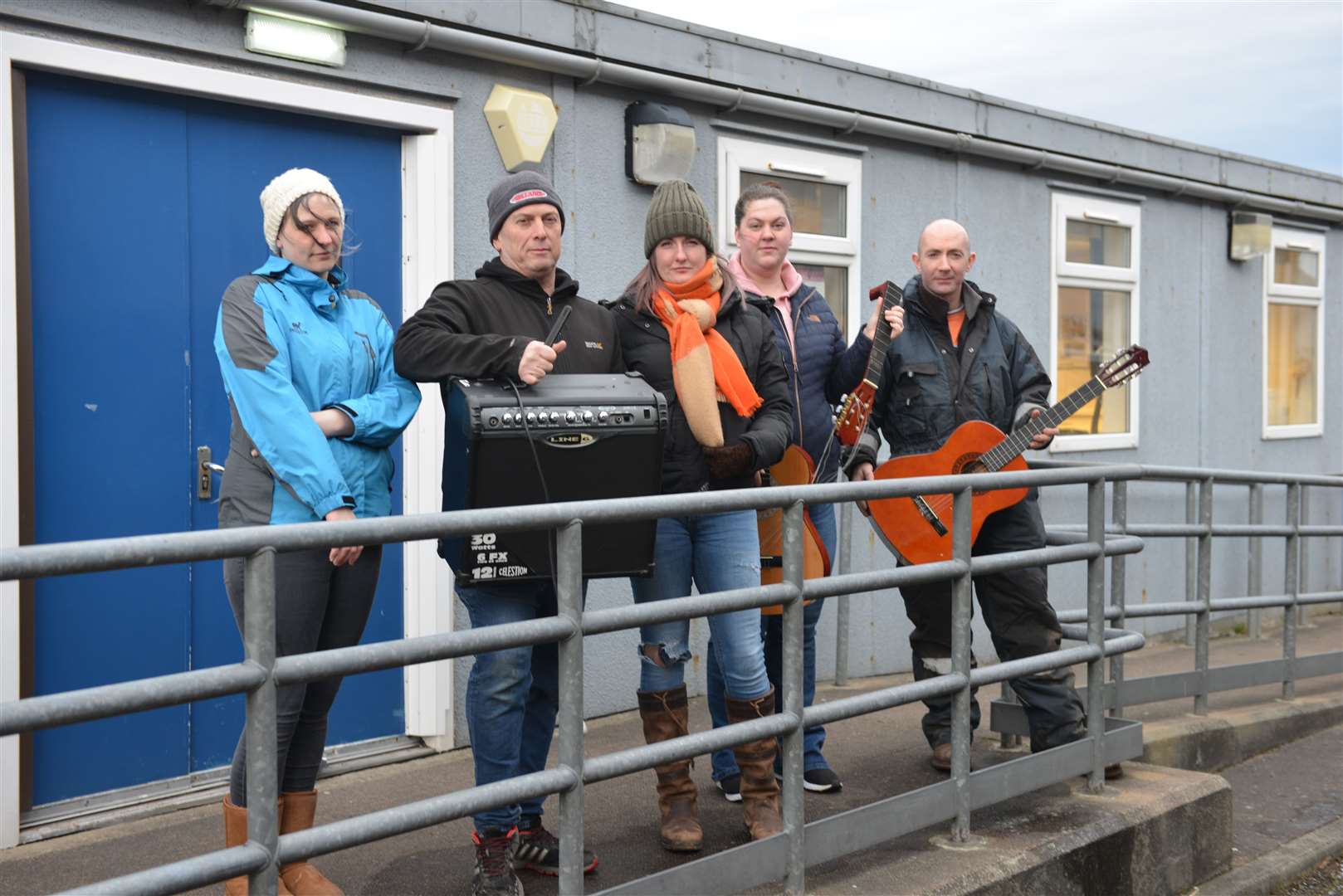 Concerned parents at the music hut last year with some of the damaged musical equipment. From left, Stephanie Rice, Gary Munro, Joanna Mackenzie, Carly Simpson and Andy Maclean. Picture: Jim Johnston
