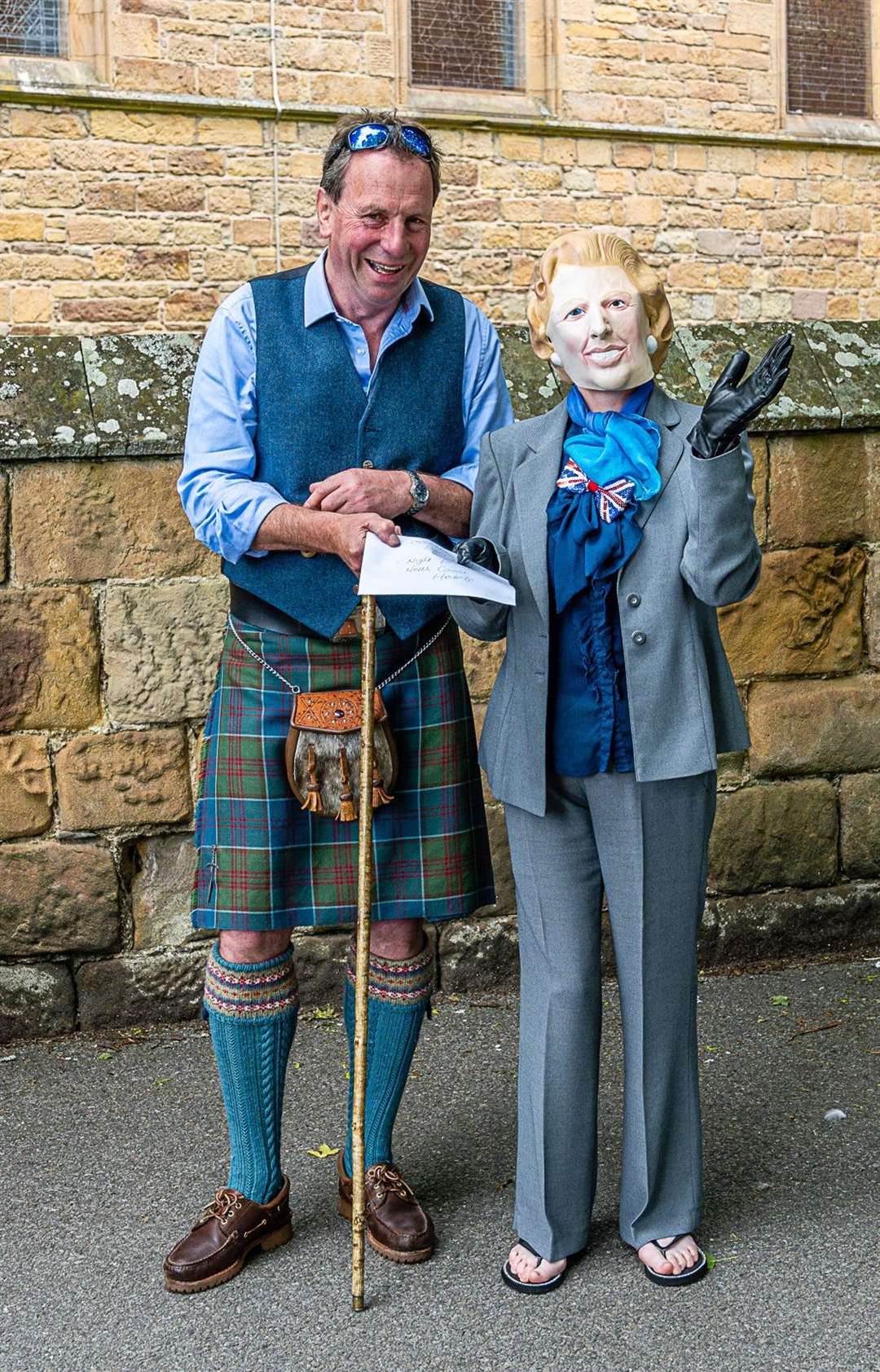 David Whiteford, chairman of Highland Coast Hotels, congratulates Sheonach Haig on winning the adult fancy dress competition as "Guess Who?" Picture: Andy Kirby