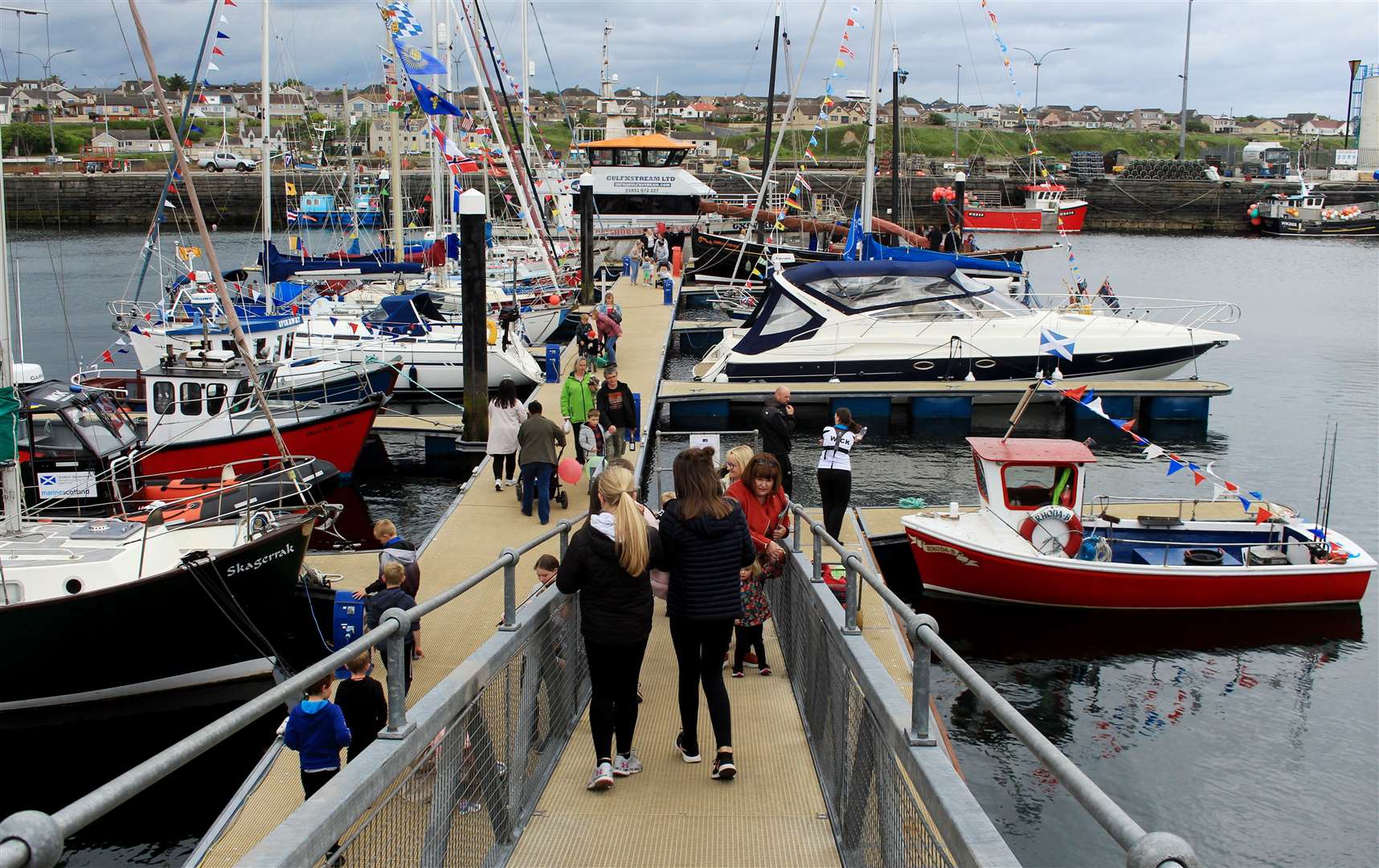 Members of the public making their way down to the harbour pontoons which were open for the day. Picture: Alan Hendry