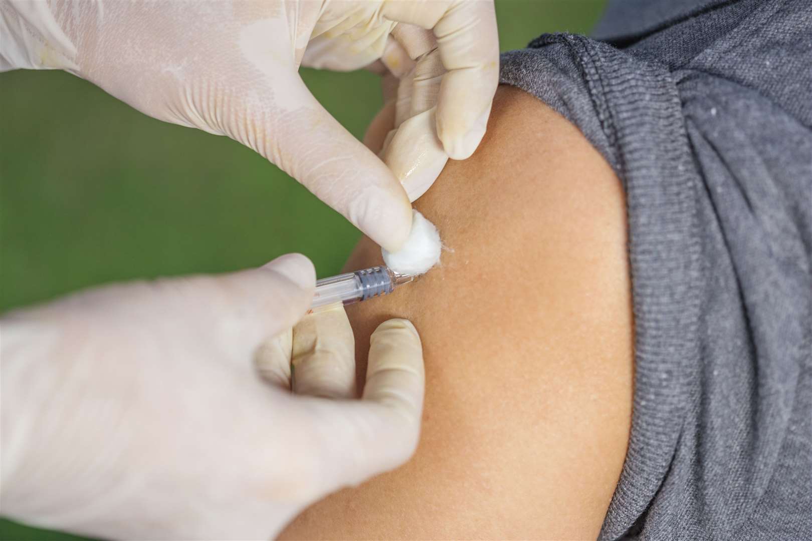 A patient is given the vaccine.