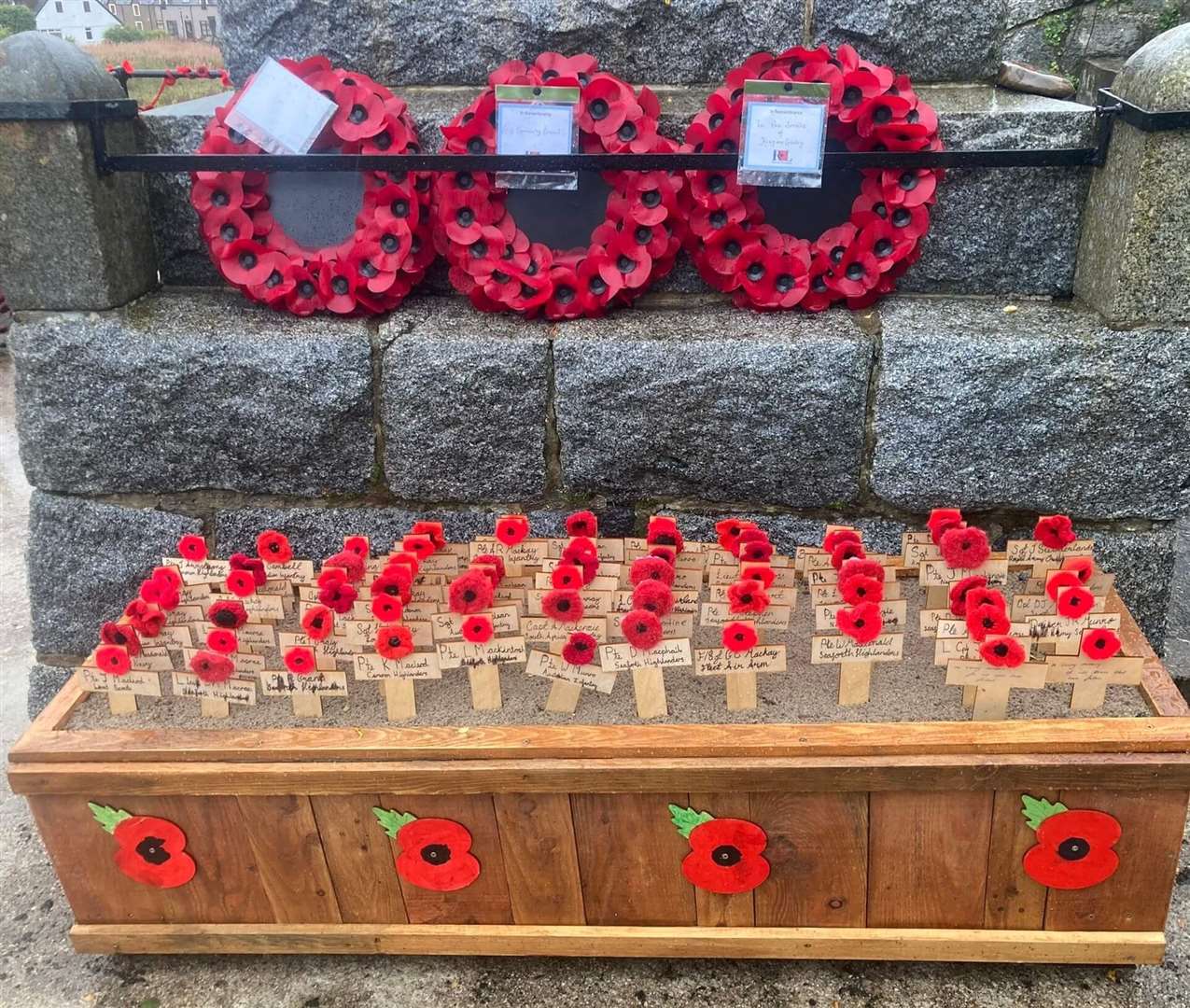 Local children planted crosses in memory of those named on the war memorial. Picture: Tracie Drummond