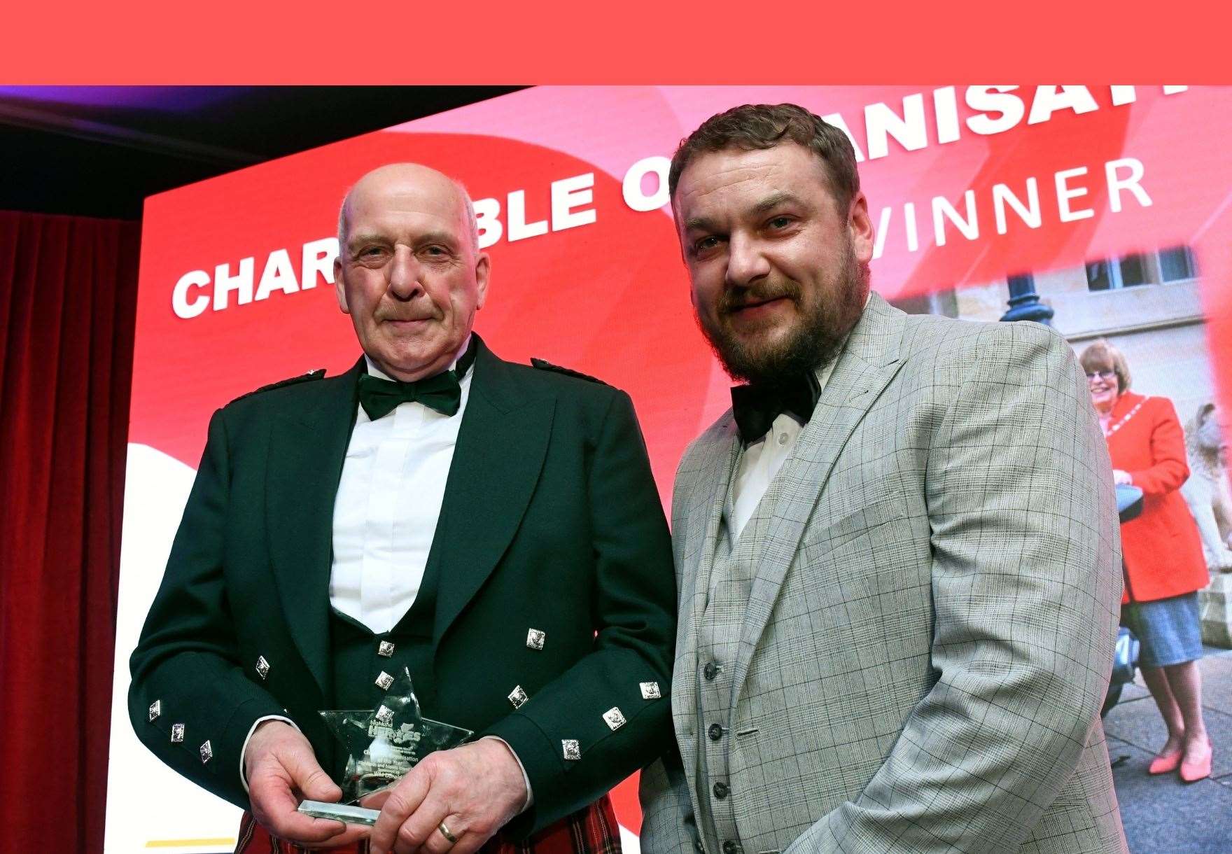Ross Sharp accepted the award for Highland & Islands Blood Bikes for the charitable organisation award in 2023, presented by Kris Brown of sponsor W M Donald. Picture: James Mackenzie